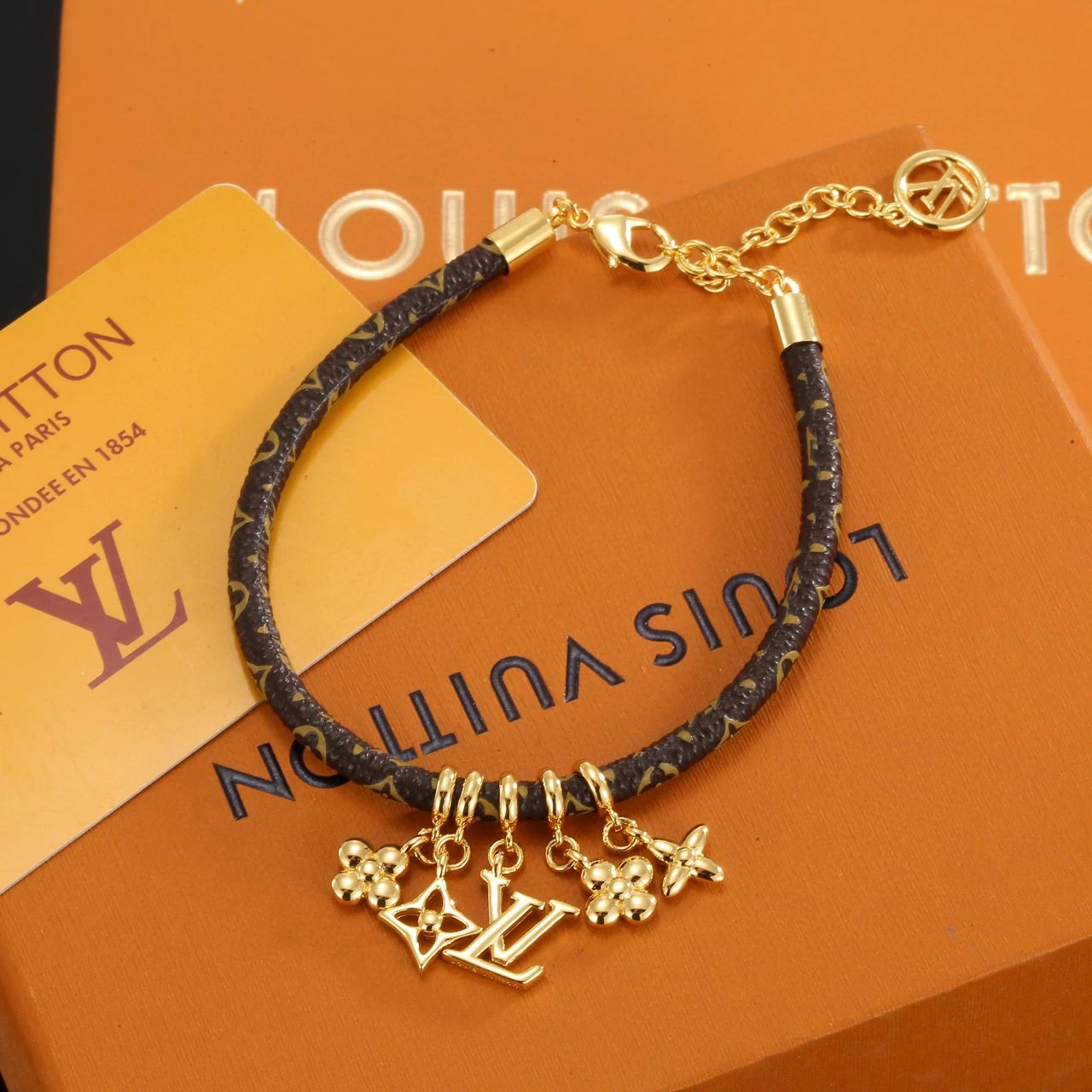 Louis Vuitton Monogram Leather Gold Charm Bracelet
