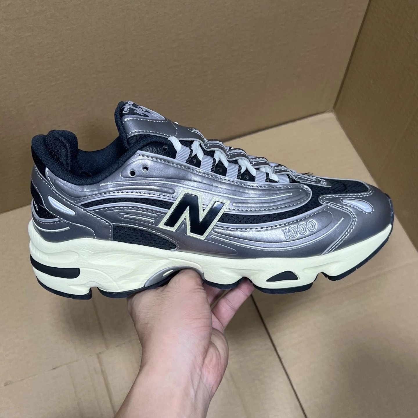 New Balance 1000 Metallic Silver Mesh Sneakers