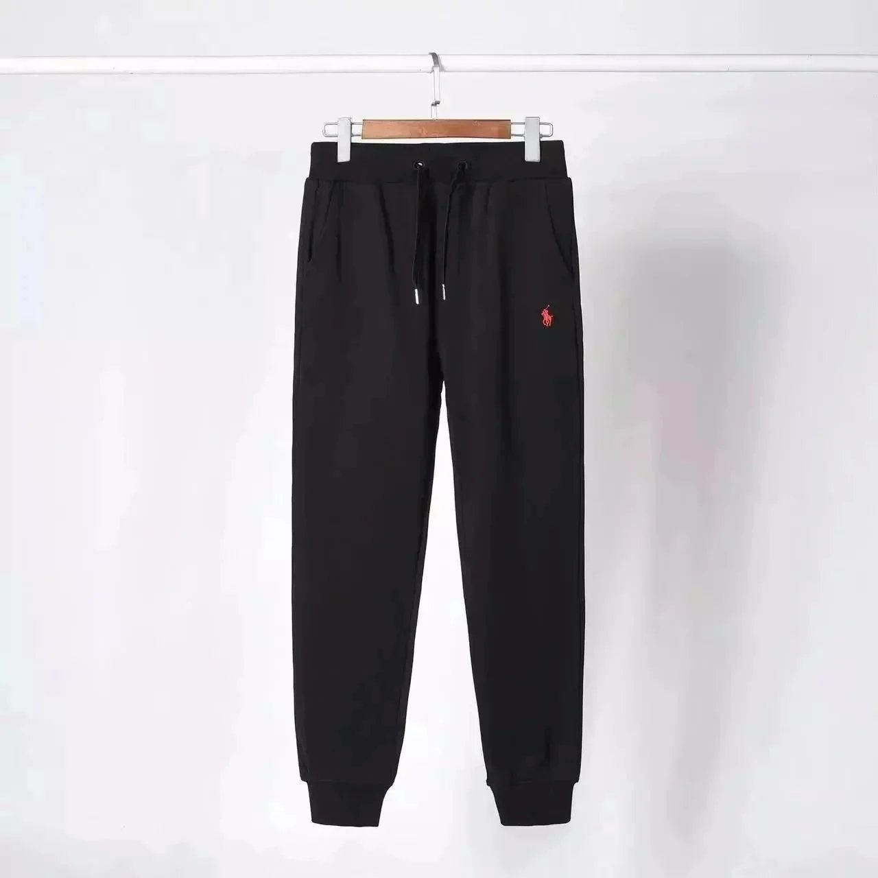 Black and red marked pants