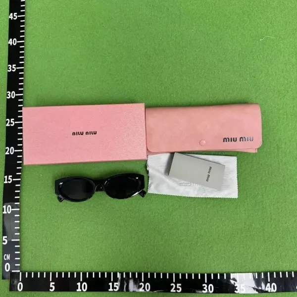 Miu Miu Oval Sunglasses Black - 1