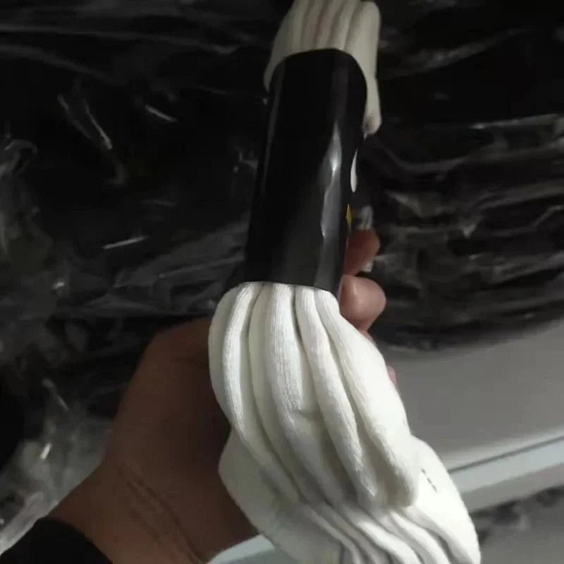 White Crew Socks with Black Cylindrical Packaging