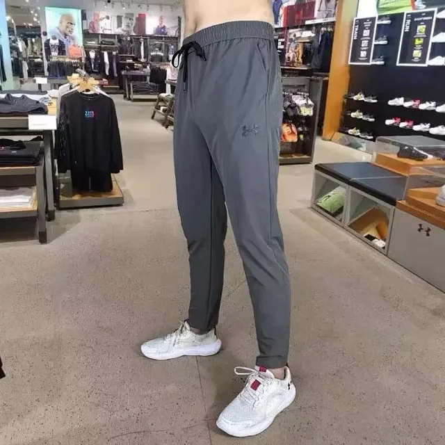 Under Armour Trousers Tapered drawstring athletic product detail image 5