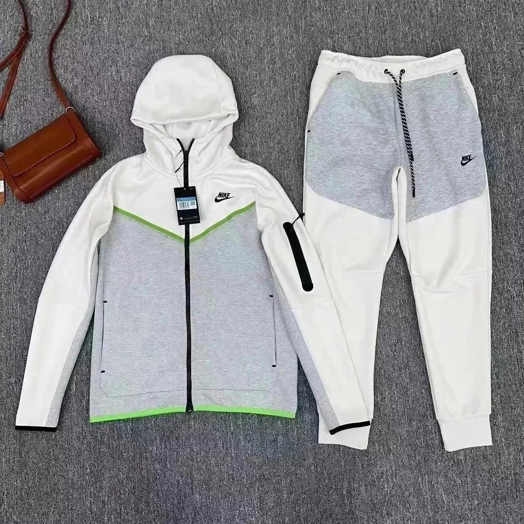 Nike Matching Sets Hooded zip-up jacket and jogger pants set — A gray, white, and green patchwork set