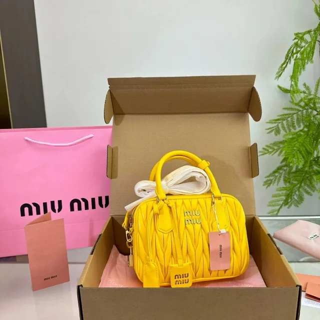 Miu Handbags Logo-Embossed Zip-Top Handbag product detail image 1