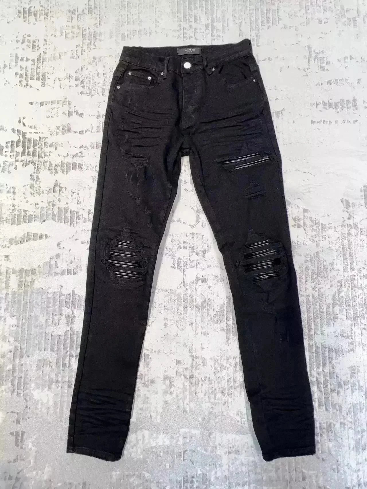 Amiri Distressed printed denim jeans image 12