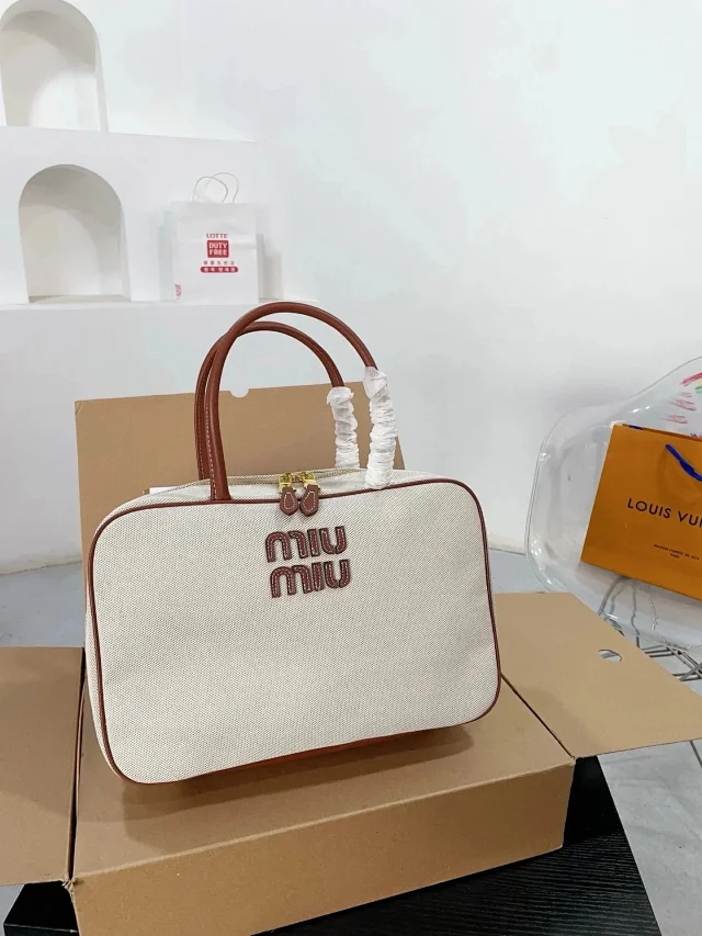 Miu Handbags Logo-Embossed Zip-Top Handbag product detail image 8