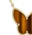 Van Cleef & Arpels Jewelry Pendant Necklaces with Clover, Butterfly and Cube Designs product detail image 4