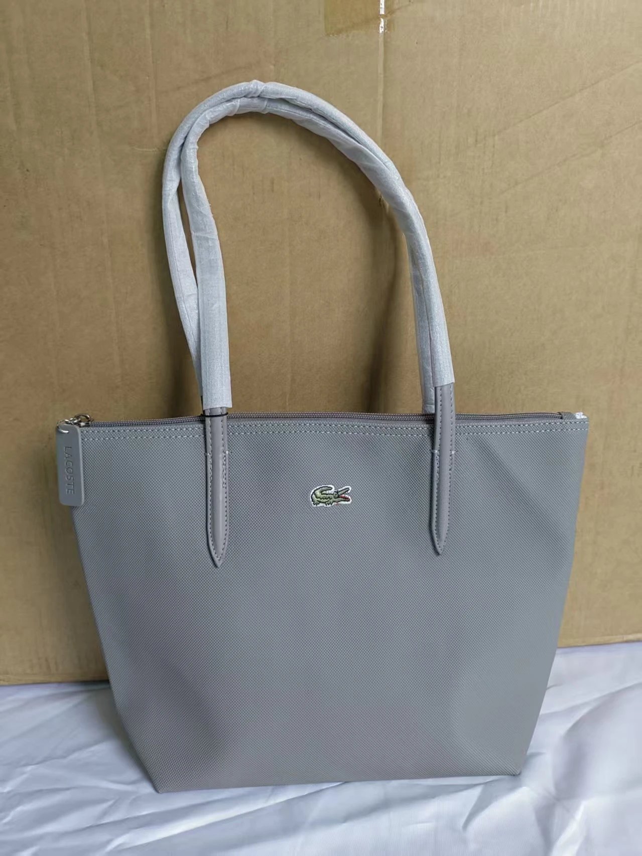 Lacoste Handbags Zip-top tote bag with long shoulder handles — Medium size, light gray