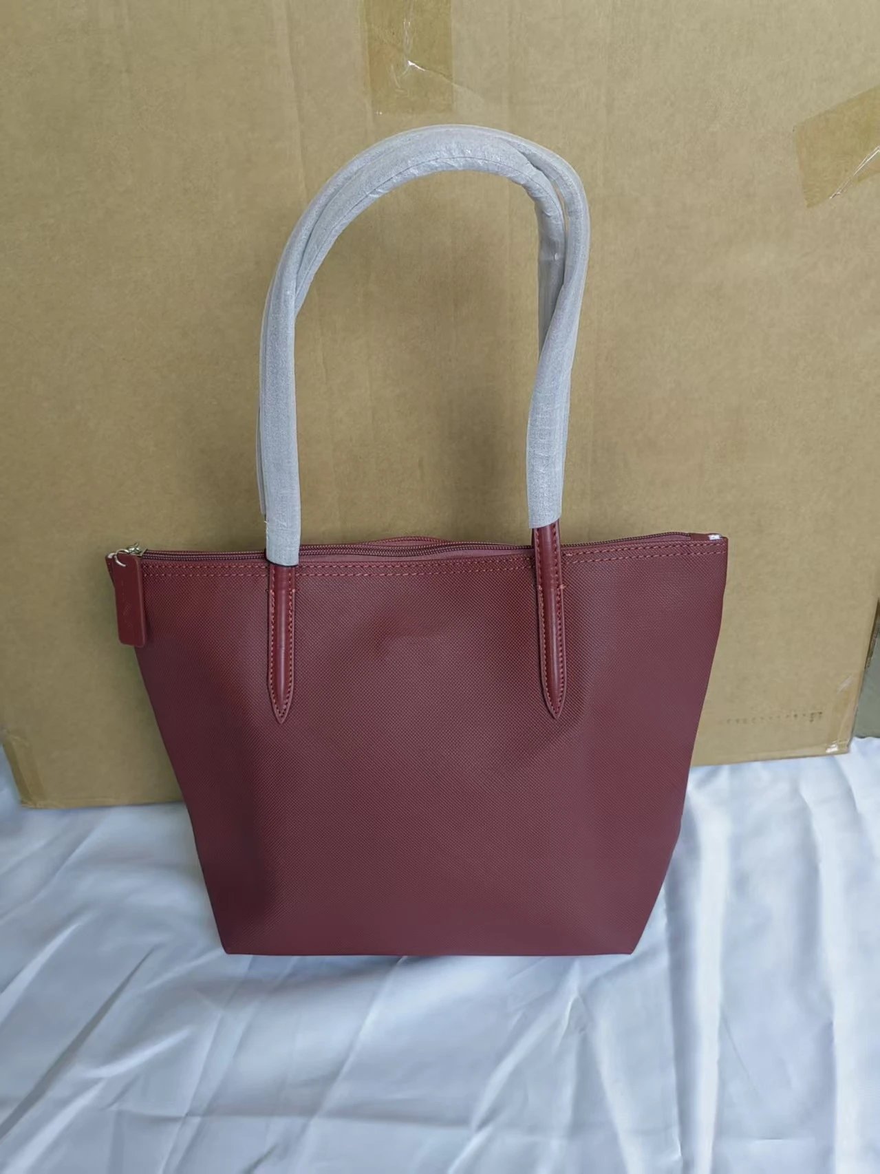 Lacoste Handbags Zip-top tote bag with long shoulder handles — Medium size, wine red