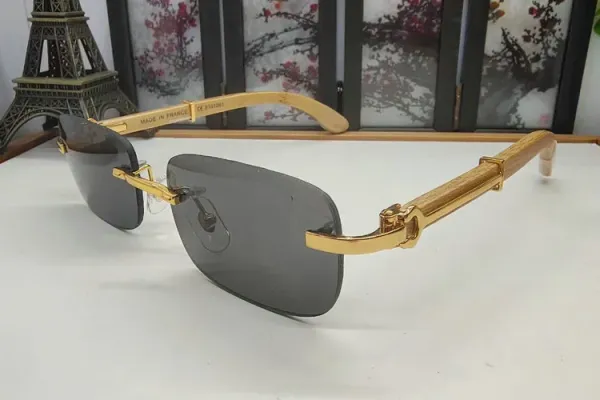 Design Rimless Sunglasses with Gold-tone Metal and Wood Accents Gray Eyewear - 1
