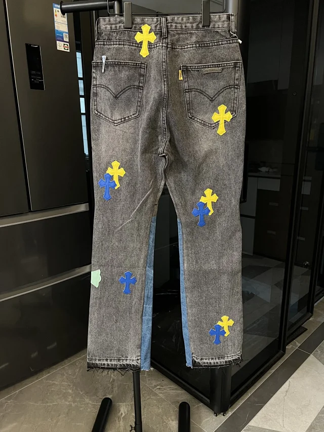 Unbranded Jeans Two-tone washed denim with multicolor cross appliqués and raw hems product detail image 4