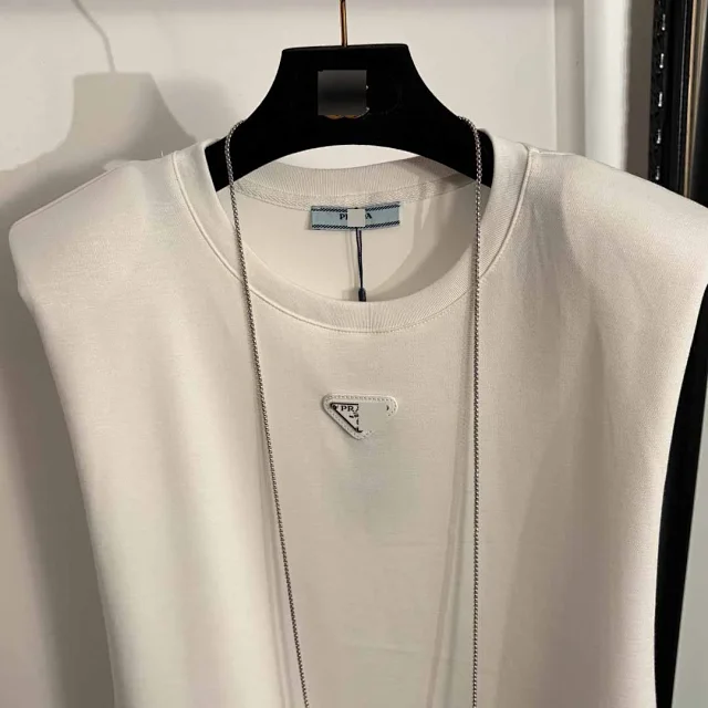 Prada Dresses Sleeveless padded-shoulder dress with triangle plaque and chain mini bag product detail image 4