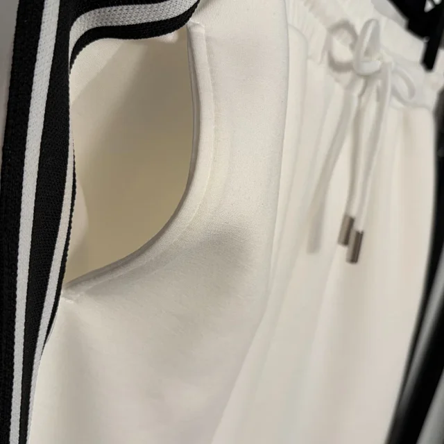 Chanel Tracksuits Short-sleeve zip-up track jacket and straight-leg trousers with contrast stripes product detail image 9