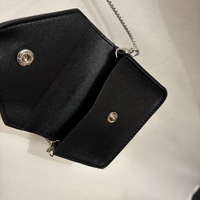 Prada Dresses Sleeveless padded-shoulder dress with triangle plaque and chain mini bag product detail image 8