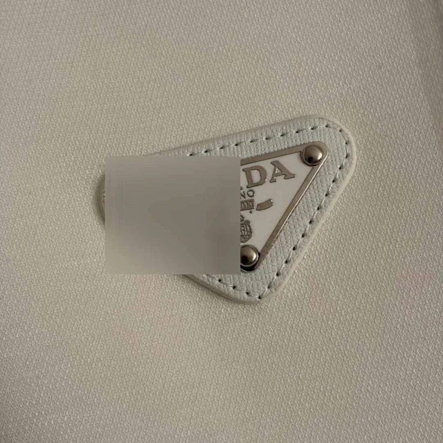 Prada Dresses Sleeveless padded-shoulder dress with triangle plaque and chain mini bag product detail image 7