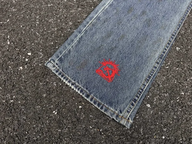 Enfants Riches Déprimés Jeans Washed patchwork flared with embroidered motif product detail image 13