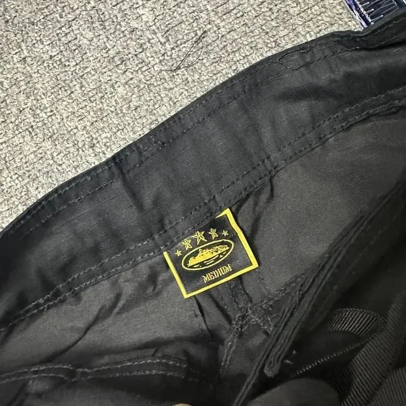 Black Cargo Pants with White Graphic Patch and Yellow Label Tactical Style