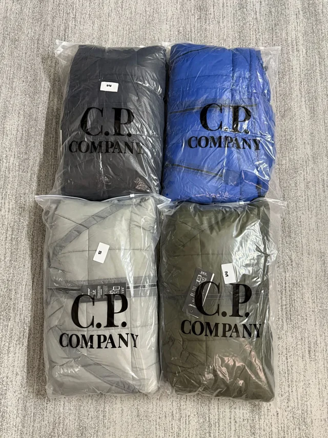 C.P. Company Jackets Hooded quilted puffer jacket with lens sleeve detail product detail image 2
