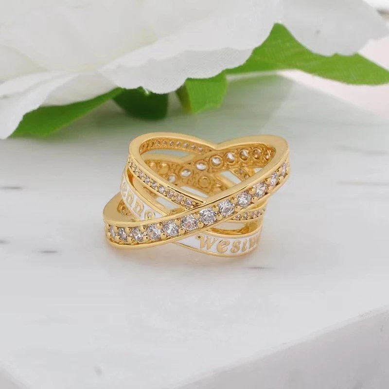 Gold Tone Cross Over White Enamel Crystal Ring