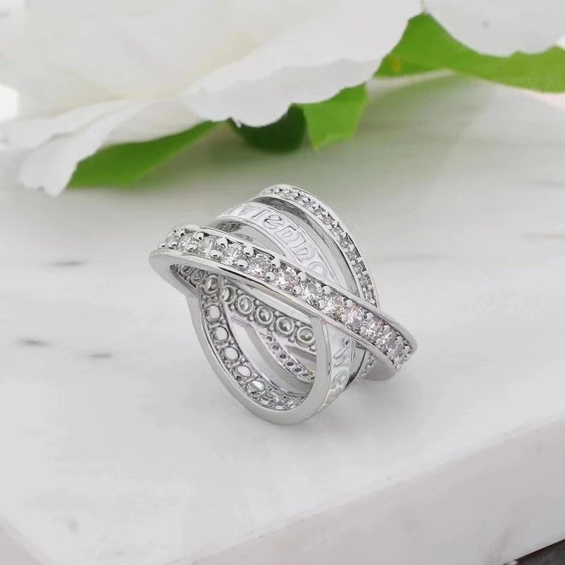 Gold Tone Cross Over White Enamel Crystal Ring