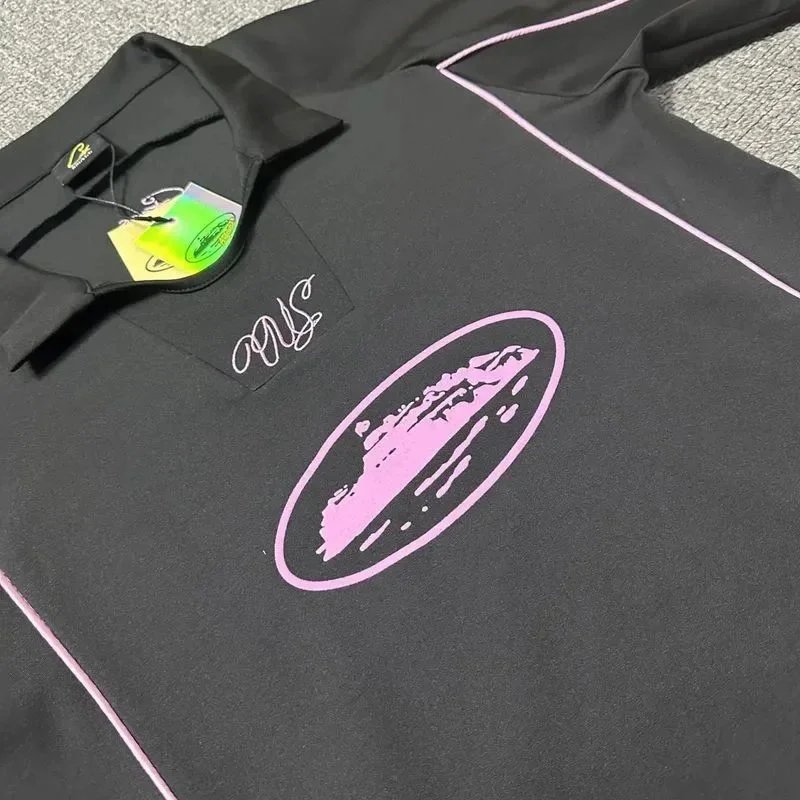 Black Performance Polo Shirt with Pink Graphic Logo and White Trim