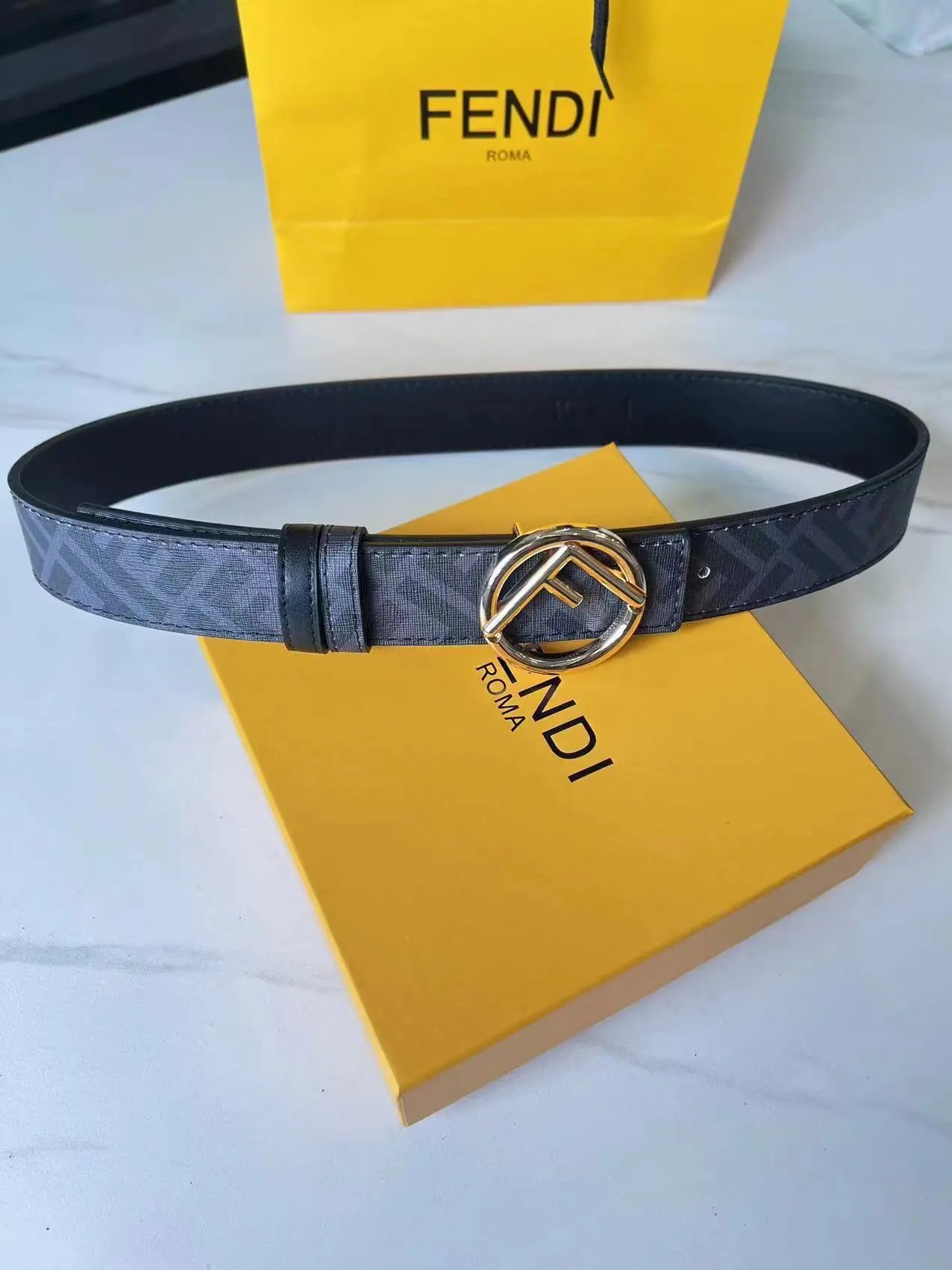 Fendi Belts FF Monogram Double-F Buckle Belt — Black flower with a round gold buckle