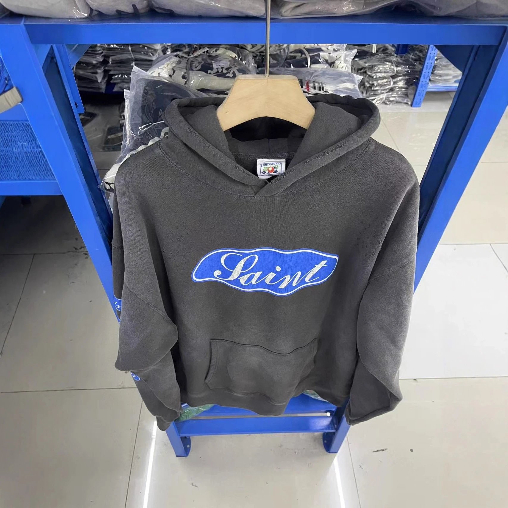 Gray Hooded Sweatshirt With 'Love Among The Demons' Print And Blue Logo Sleeves