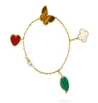 Van Cleef & Arpels Alhambra Bracelet with Tiger's Eye, Malachite, Red Coral, and Mother-of-Pearl Charms Gold Bracelet - 1