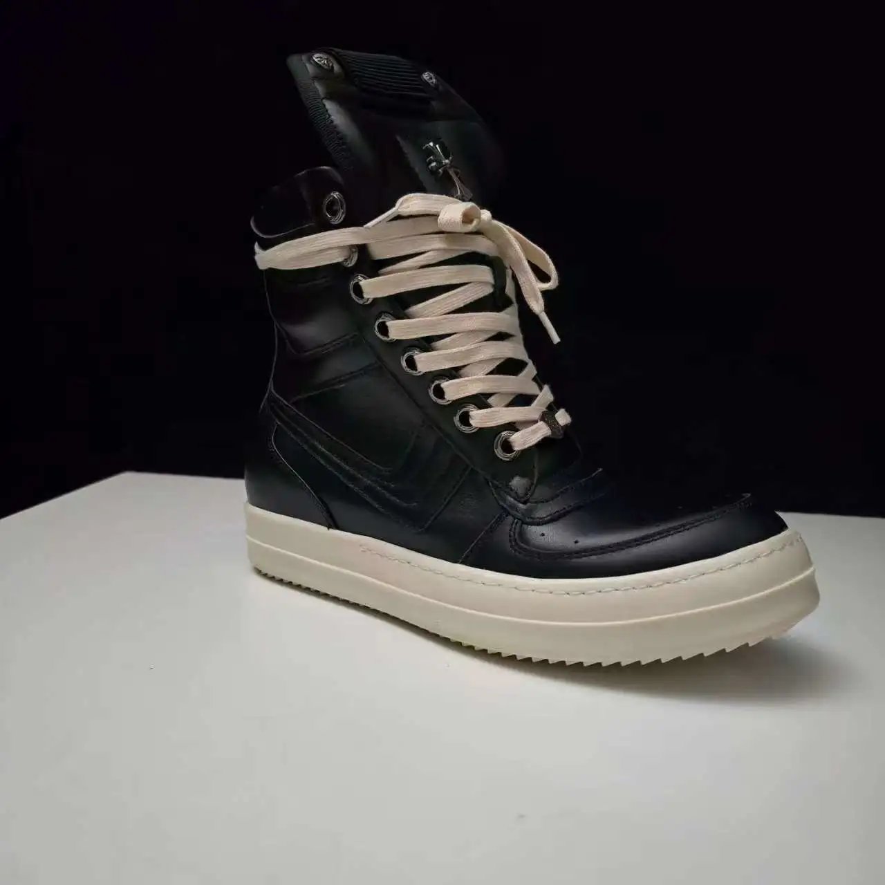 Rick Owens Boots High-Top Lace-Up Side-Zip with Cross Hardware — All-black face, rice-colored base, large hook-shaped cross