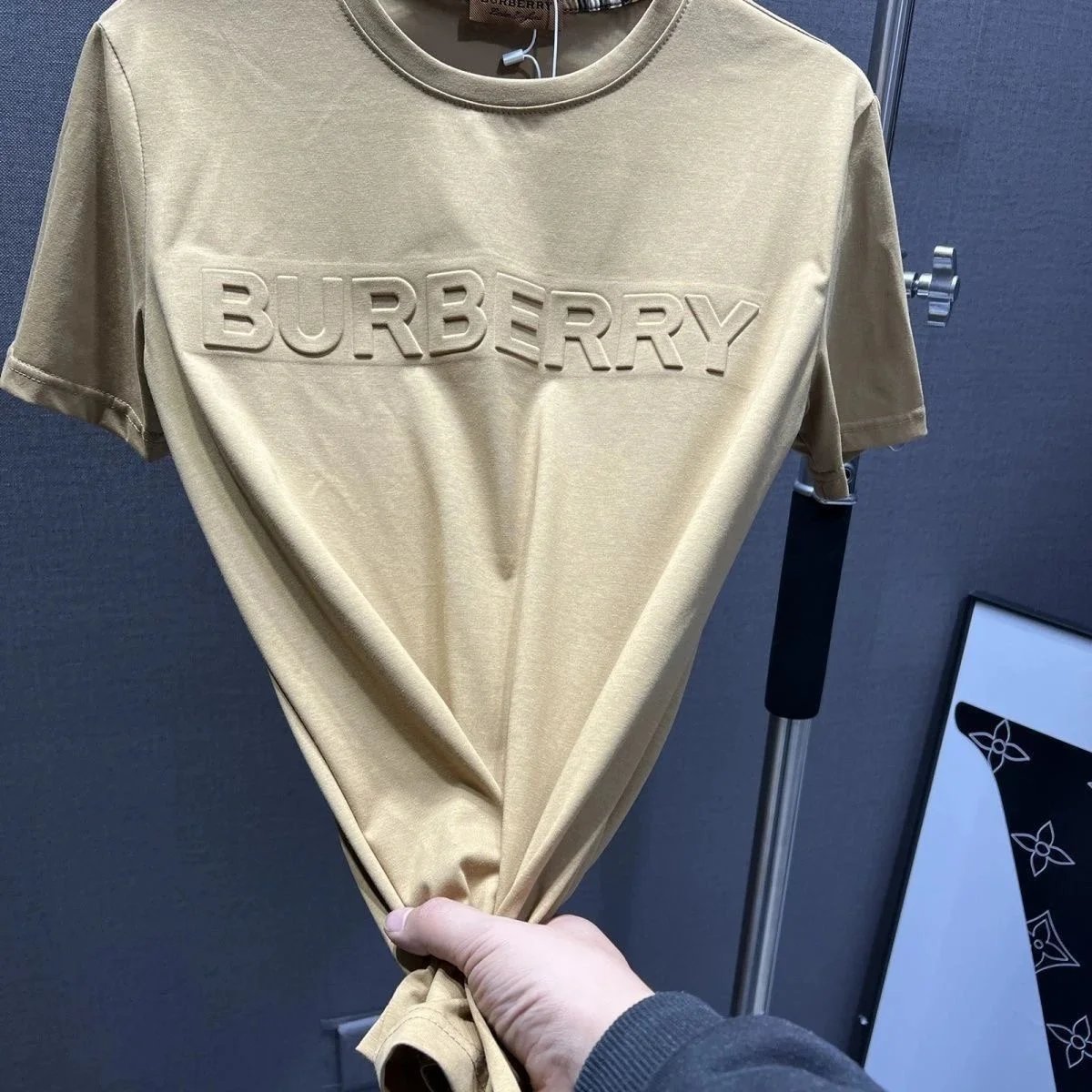 Khaki short sleeved logo with large lettering