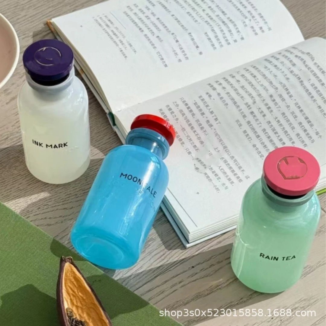 Assorted Generic Eau de Parfum Bottles with Colored Caps and Minimalist Typography