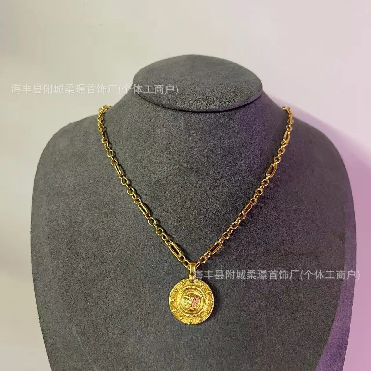 Gold Tone Figaro Chain Necklace with Medusa Head Coin Pendant