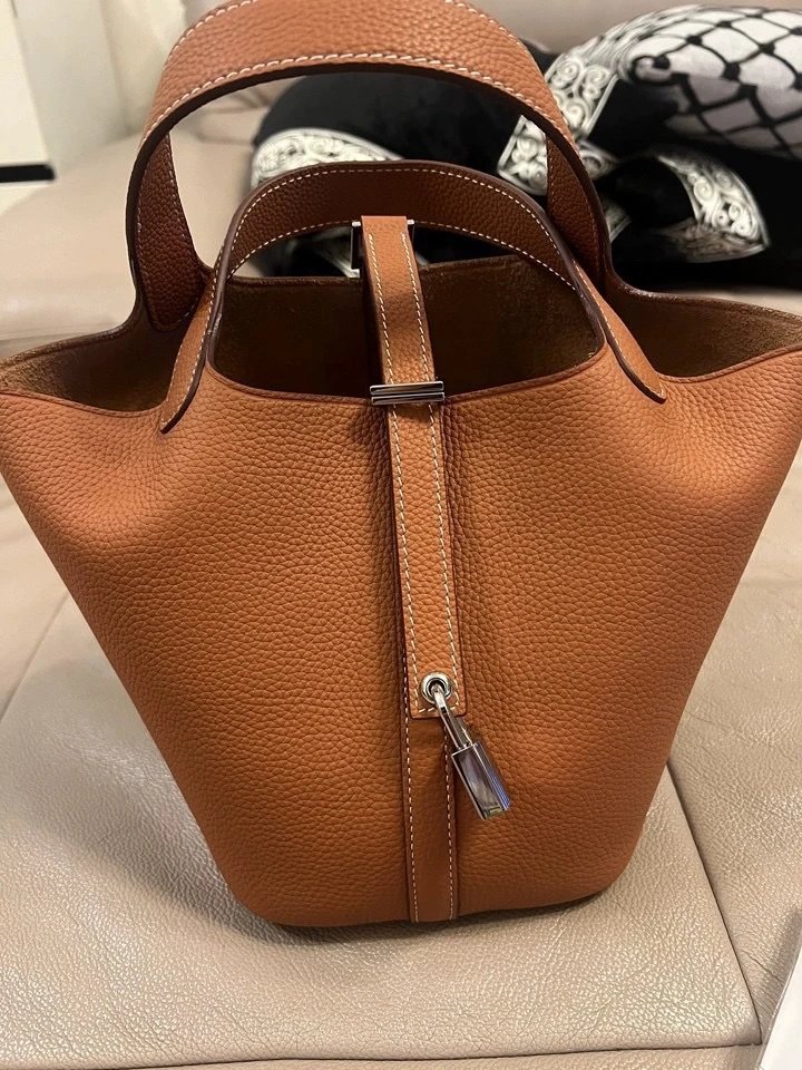 Pebbled Leather Bucket Bag with Vertical Strap and Padlock