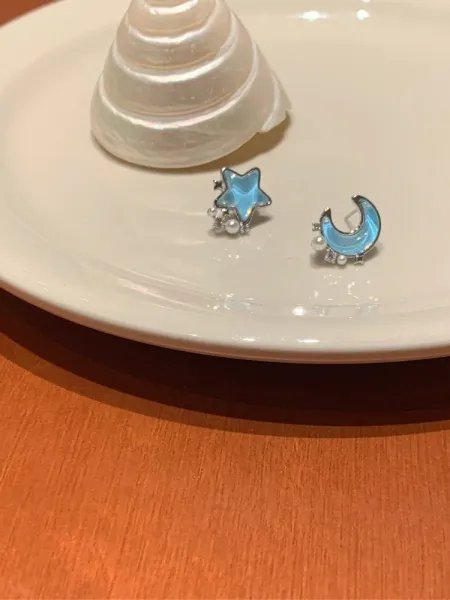 Design Star and Moon Earrings in Iridescent Blue with Pearl Accents - 1
