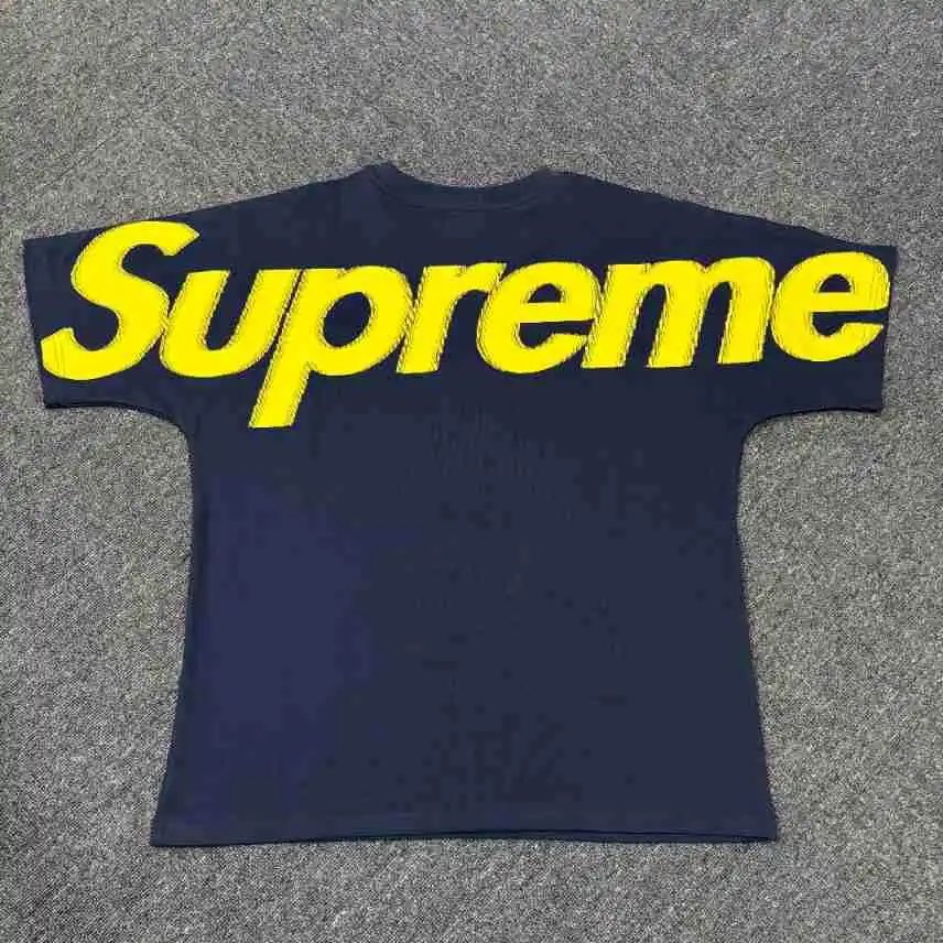 Supreme T-Shirts Logo Print Short-Sleeve T-Shirt — Blue background with a yellow label