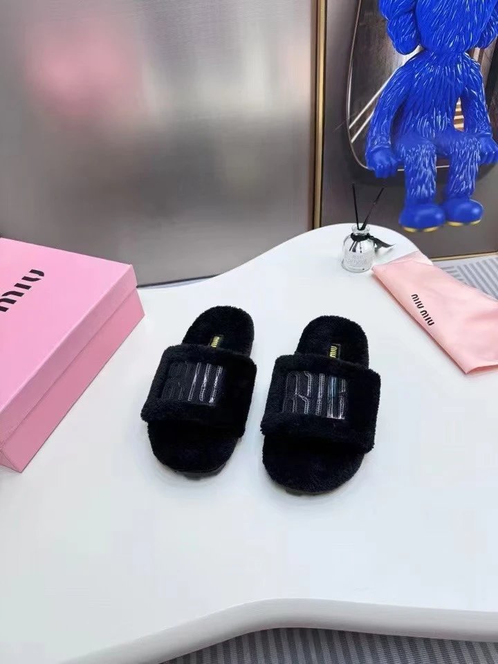 Miu Slippers Faux-fur open-toe slide with logo strap — Black