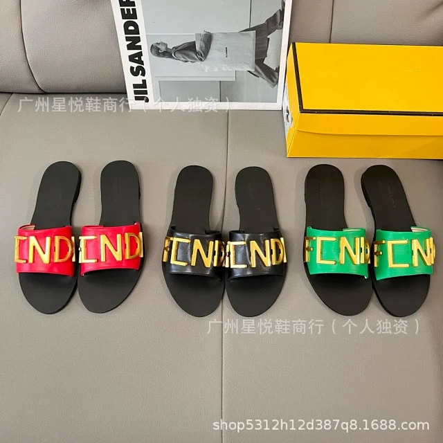 Fendi Sandals Flat slide with gold logo lettering product detail image 1