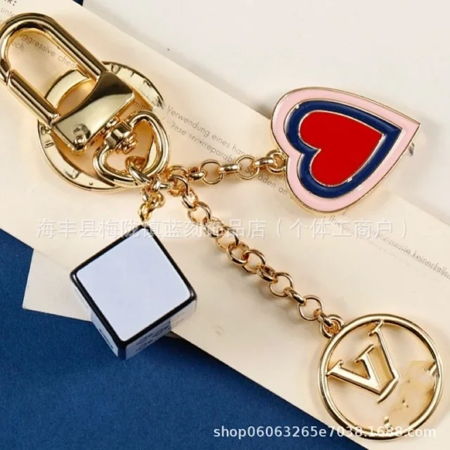 Louis Vuitton Uncategorized Metal car keychain with LV monogram and floral charms product detail image 2