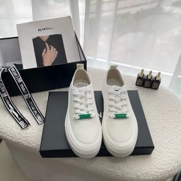 Chanel White Canvas Sneakers with Green Logo Tag - 1