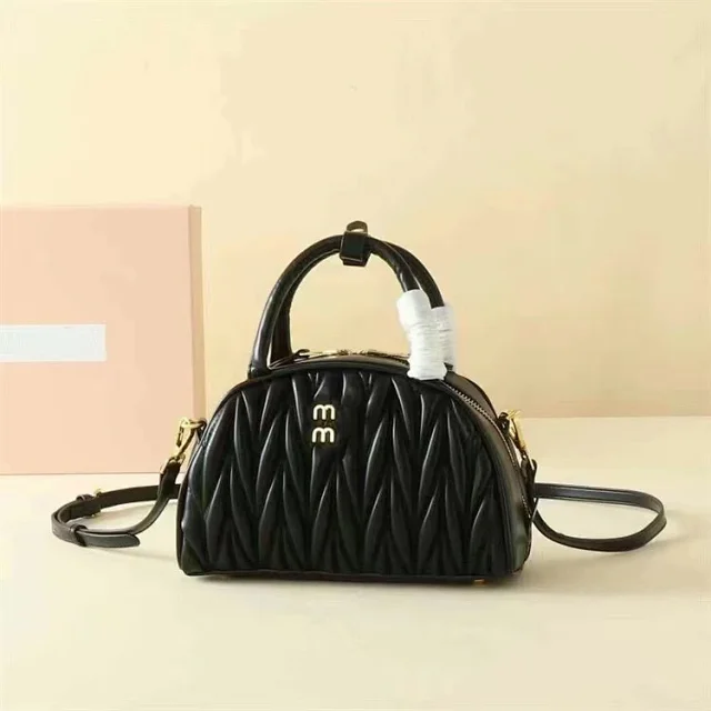 Miu Handbags Quilted semicircle top-handle bag with detachable shoulder strap product detail image 6