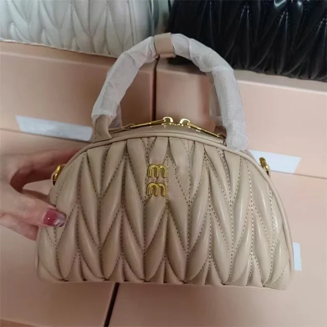 Miu Handbags Quilted semicircle top-handle bag with detachable shoulder strap product detail image 3
