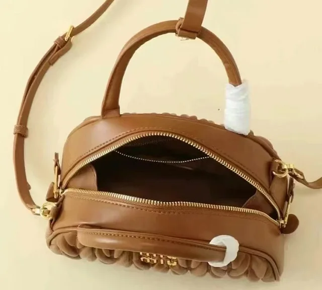 Miu Handbags Quilted semicircle top-handle bag with detachable shoulder strap product detail image 11