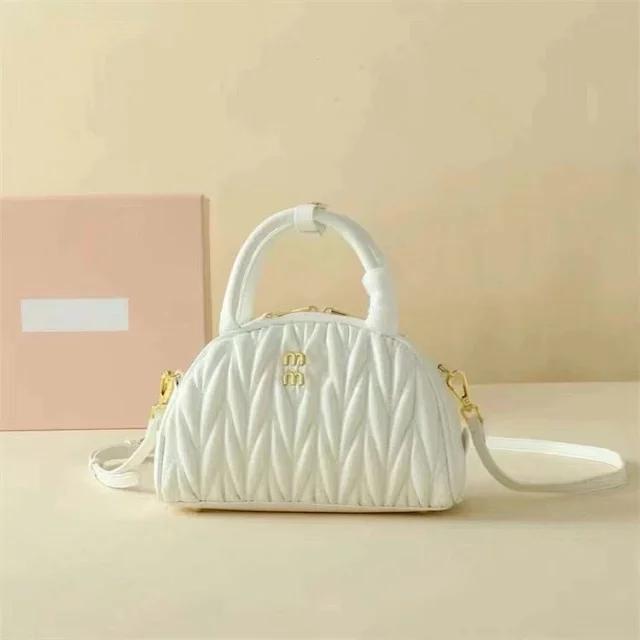 Miu Handbags Quilted semicircle top-handle bag with detachable shoulder strap product detail image 7