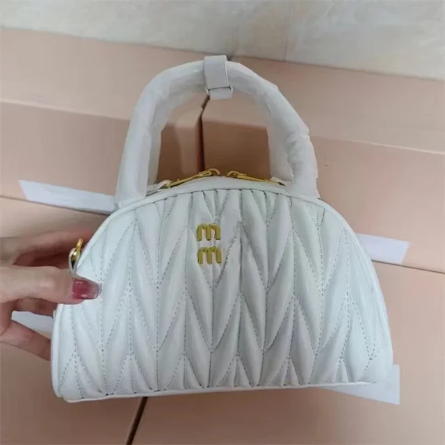 Miu Handbags Quilted semicircle top-handle bag with detachable shoulder strap product detail image 5