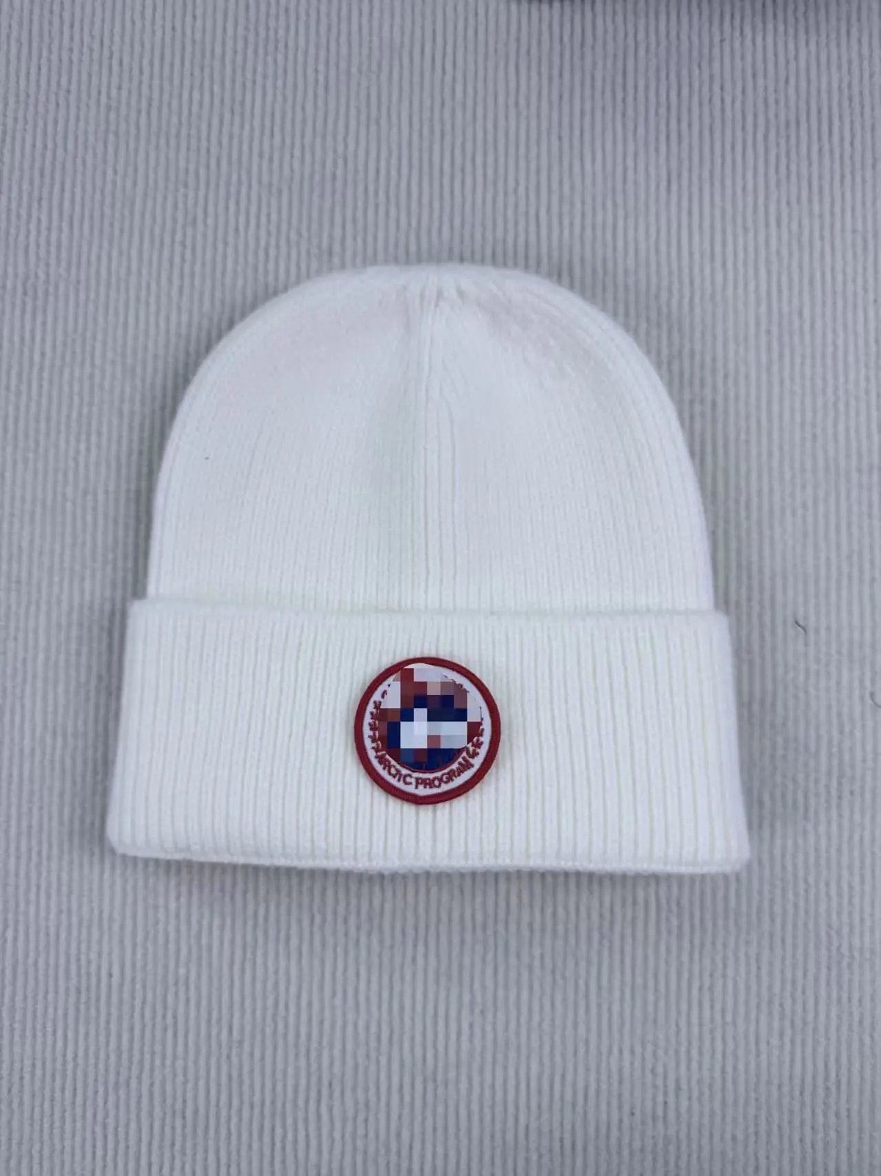 Black Badge Beanie — Positive red mark white colorway — USFans Spreadsheet photo