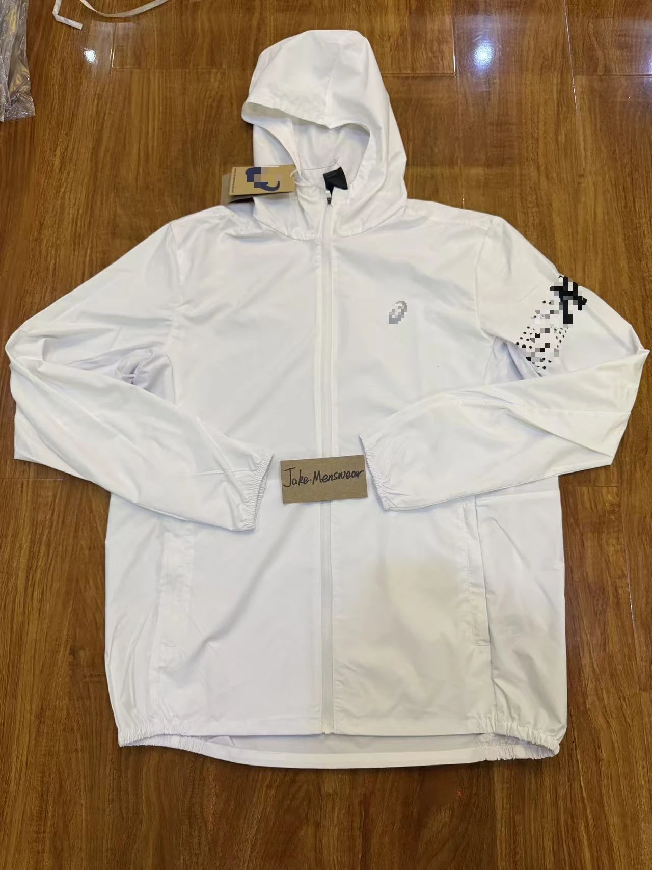 ASICS Jackets Hooded full-zip windbreaker jacket with contrast zipper and dotted sleeve graphic — White coat