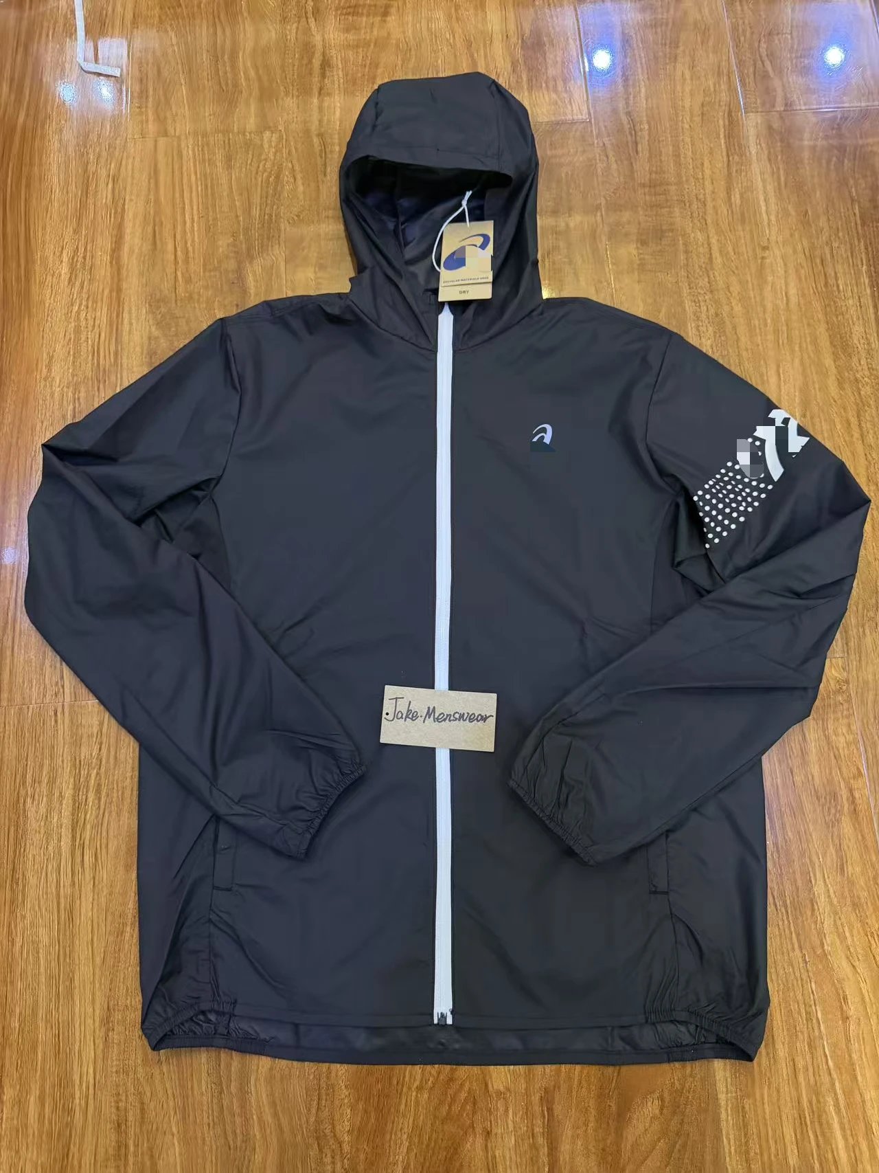 ASICS Jackets Hooded full-zip windbreaker jacket with contrast zipper and dotted sleeve graphic — Black coat