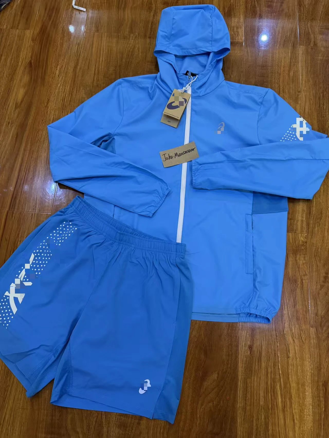 ASICS Jackets Hooded full-zip windbreaker jacket with contrast zipper and dotted sleeve graphic — Light blue two-piece set