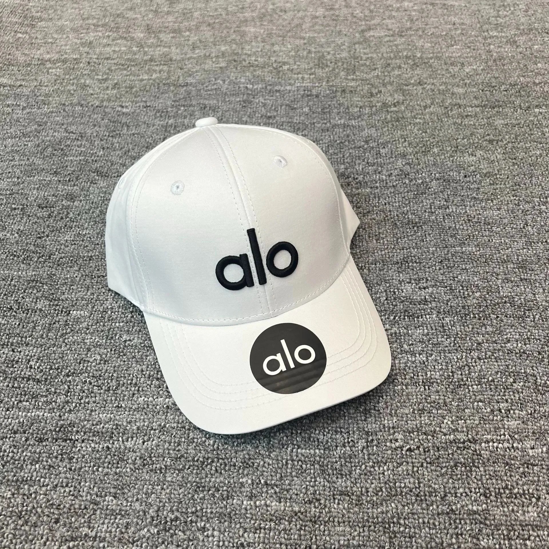 Alo Hats Embroidered Logo Baseball Cap — White embroidery with black letters