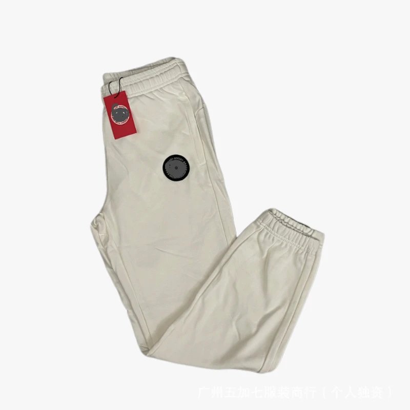 White pants with black label